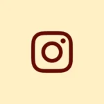Dark brown outline of the Instagram logo on a cream background. Top 5 freelance digital marketing analysts in kozhikode
